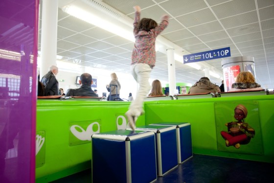 Some airports, such as Paris-Orly, provide spaces for kids to burn off energy before boarding a plane.